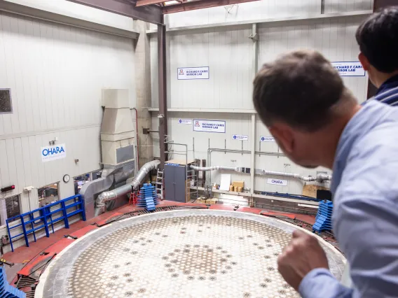 back of head of person and mirror casting station at mirror casting station.