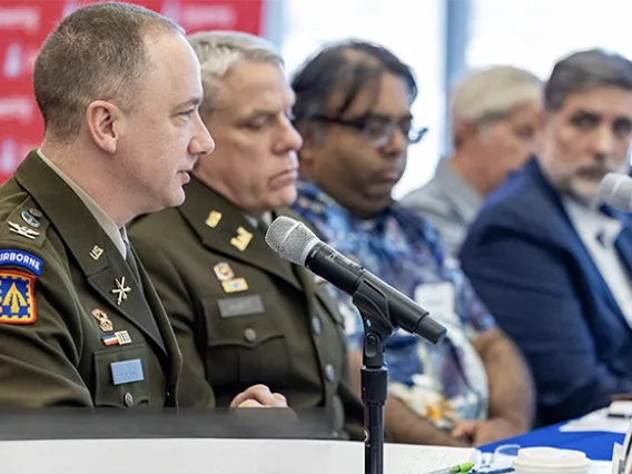 Military officers and U of A researchers at conference table