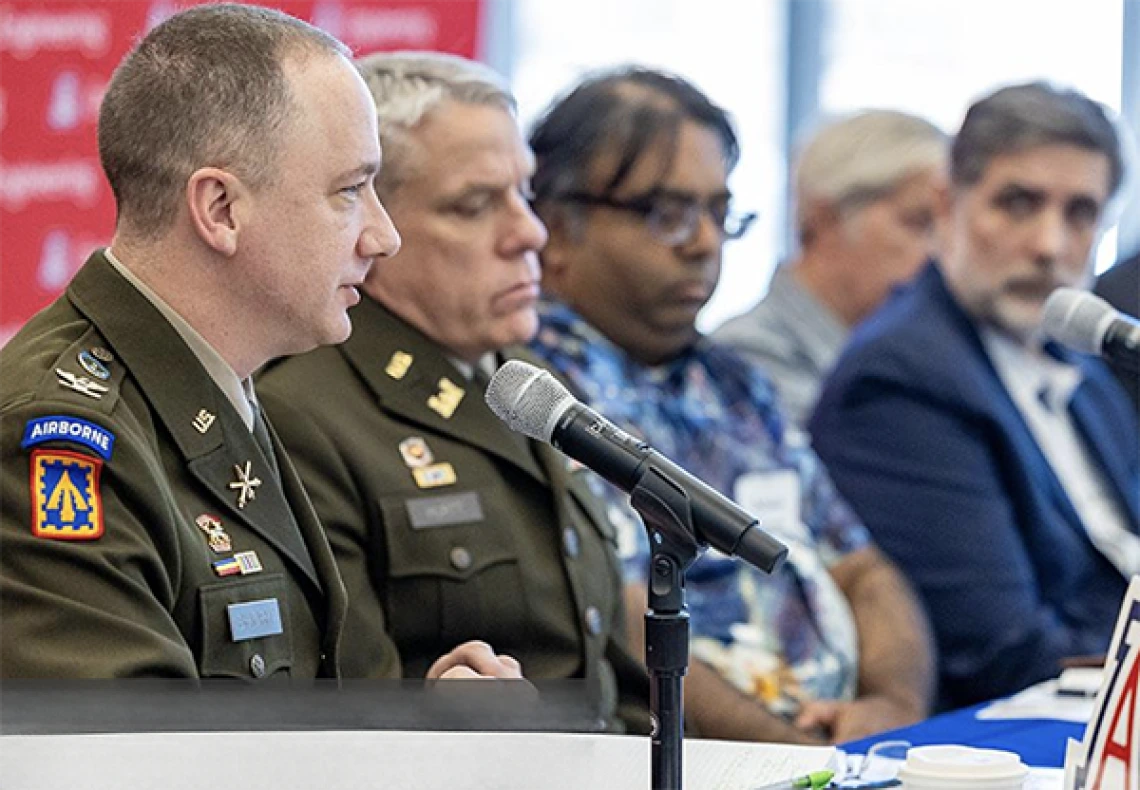 Military officers and U of A researchers at conference table