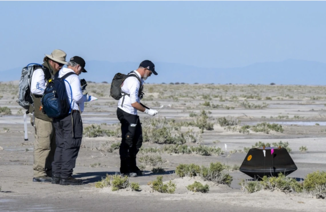 Dante Lauretta (right), U of A Regents Professor and OSIRIS-REx principal investigator, collects science data with NASA Astromaterials Curator Francis McCubbin and NASA Sample Return Capsule Science Lead Scott Sandford shortly after the sample return capsule from NASA's OSIRIS-REx mission landed at the Department of Defense's Utah Test and Training Range on Sept. 24, 2023. The sample was collected from the asteroid Bennu in October 2020.