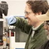 Reddy and Battle prepare to take spectra of meteorites that will help them better understand asteroid surfaces. These measurements are taken in the lab at the Kuiper Space Science Building.